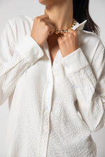 White baby button-down shirt